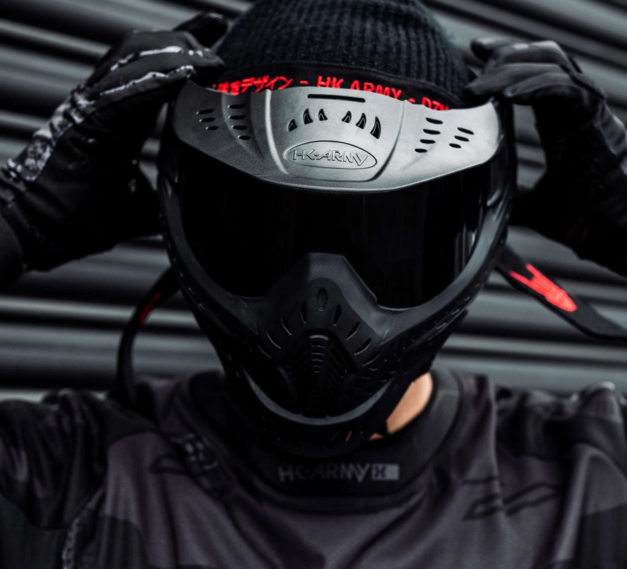 Person wearing Maddog HK Army HSTL Goggle full-face paintball and airsoft mask with anti-fog thermal lens in black color.